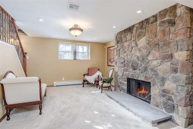 sitting room with visible vents, a baseboard radiator, stairs, carpet floors, and a fireplace