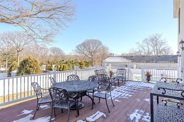 wooden deck with outdoor dining area