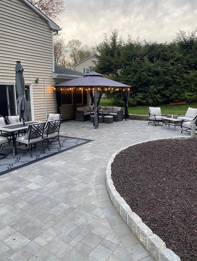 view of patio with a gazebo and an outdoor hangout area