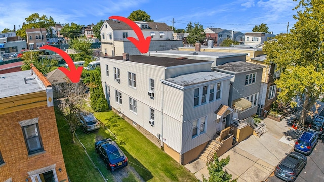 birds eye view of property with a residential view