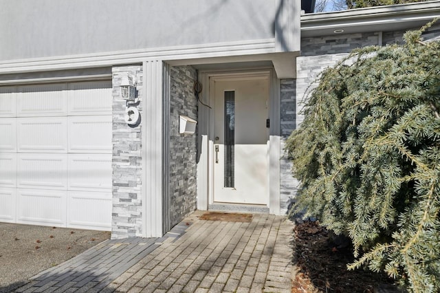 view of exterior entry featuring stone siding