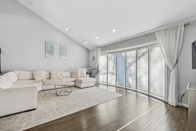 living room featuring high vaulted ceiling, wood finished floors, and recessed lighting