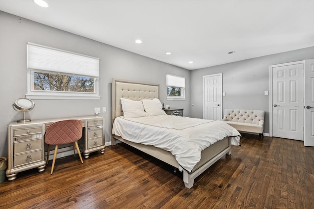 bedroom with baseboards, dark wood finished floors, and recessed lighting