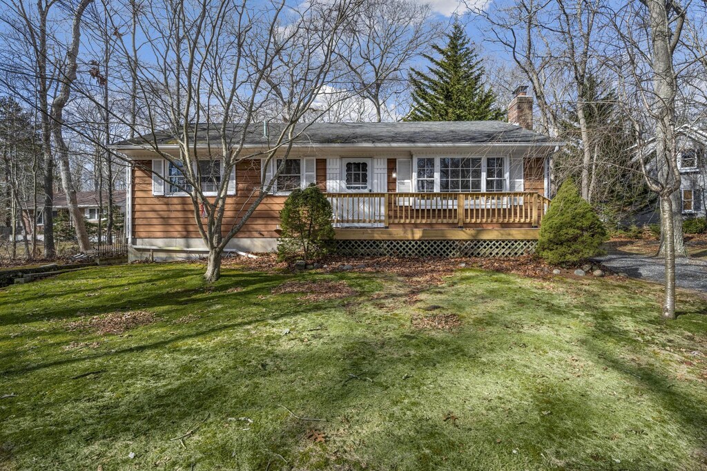 20 Crystal Beach Blvd, Moriches, NY 11955 - view of front facade with a deck, a front yard, and a chimney
