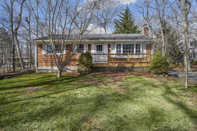 20 Crystal Beach Blvd, Moriches, NY 11955 - view of front facade with a deck, a front yard, and a chimney