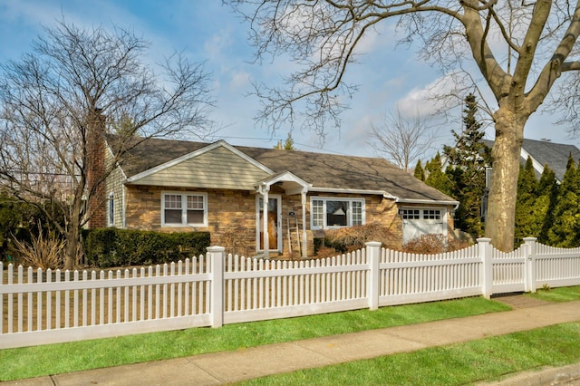 view of front facade with a fenced front yard, stone siding, a chimney, and a garage