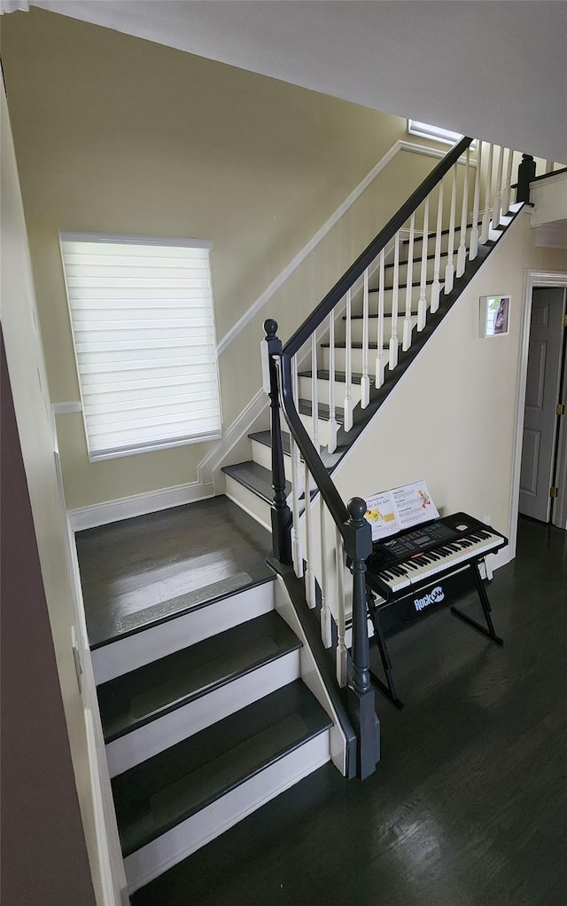 staircase featuring wood finished floors