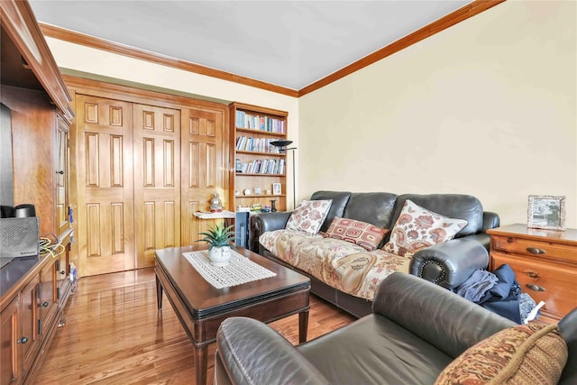 living room featuring light wood finished floors and ornamental molding