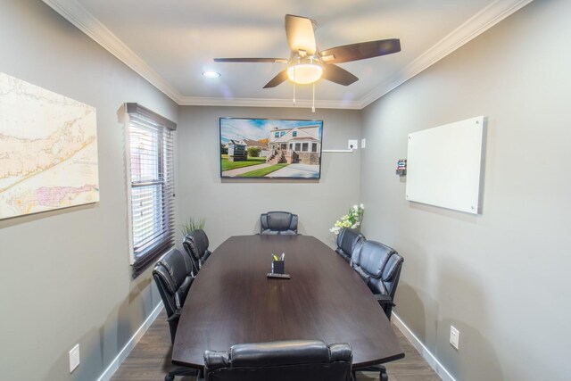 dining area featuring ceiling fan, crown molding, and dark wood-type flooring