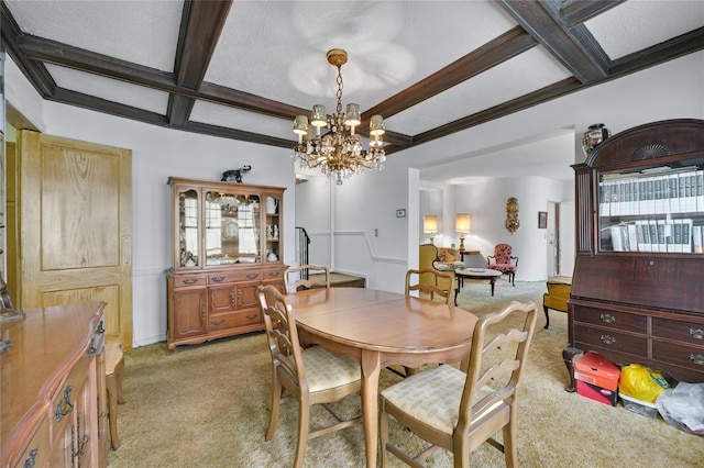 dining space featuring beamed ceiling, light carpet, coffered ceiling, and a chandelier