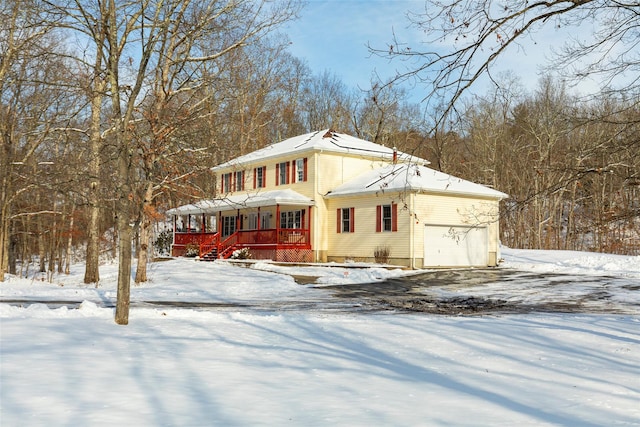 view of front of property featuring a porch and an attached garage