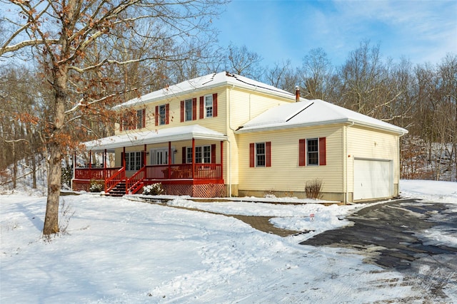 view of front of property with a porch and an attached garage