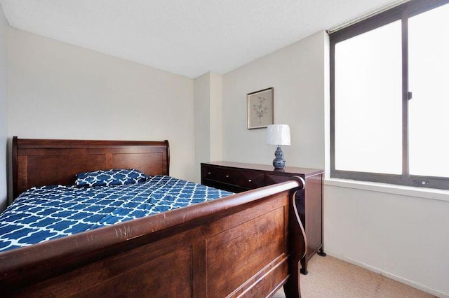 bedroom with light colored carpet