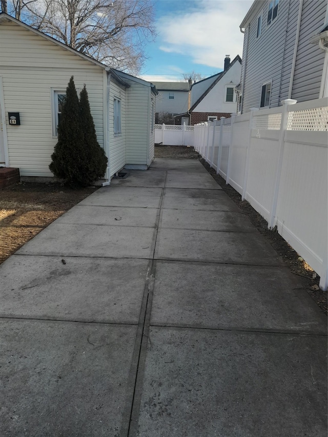 view of side of property featuring a patio area