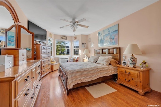 bedroom with ceiling fan and light wood-style flooring