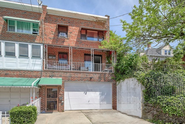 4016 Wilder Ave, Bronx, NY 10466 - townhome / multi-family property featuring brick siding, an attached garage, and concrete driveway