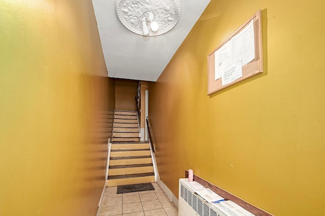4016 Wilder Ave, Bronx, NY 10466 - stairway featuring tile patterned flooring and baseboards