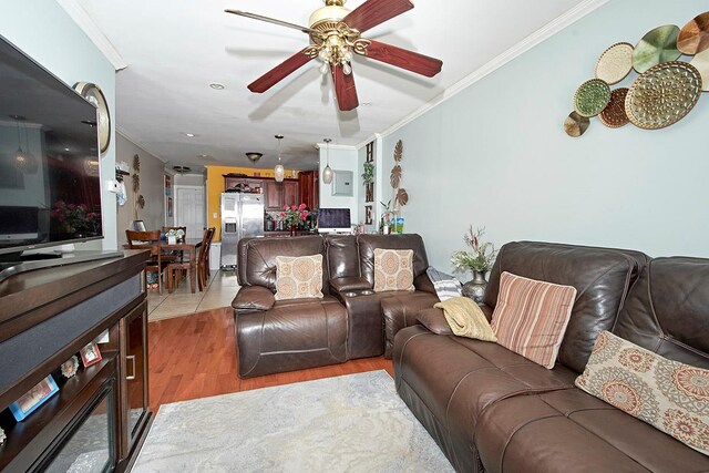 4016 Wilder Ave, Bronx, NY 10466 - living area with crown molding, light wood finished floors, and ceiling fan