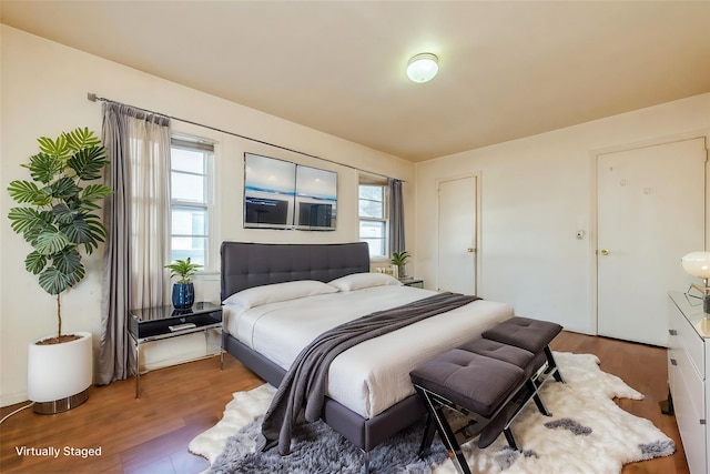 bedroom with wood finished floors