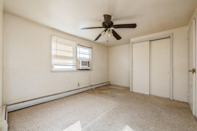 unfurnished bedroom featuring cooling unit, a baseboard heating unit, carpet floors, a ceiling fan, and a closet