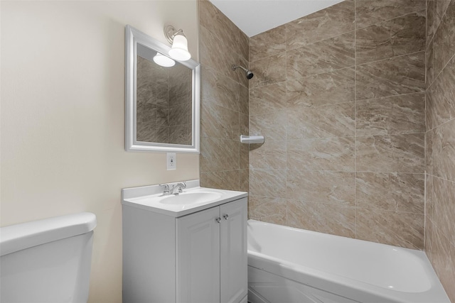 bathroom with shower / bathing tub combination, vanity, and toilet