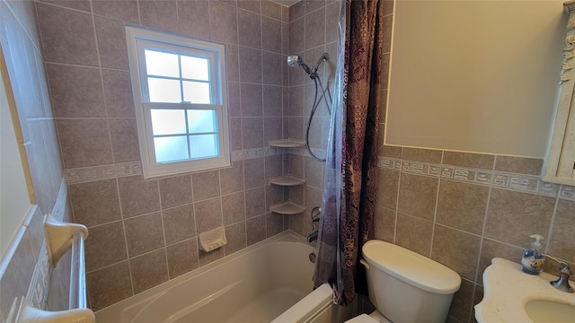 full bathroom with shower / tub combo with curtain, toilet, and tile walls