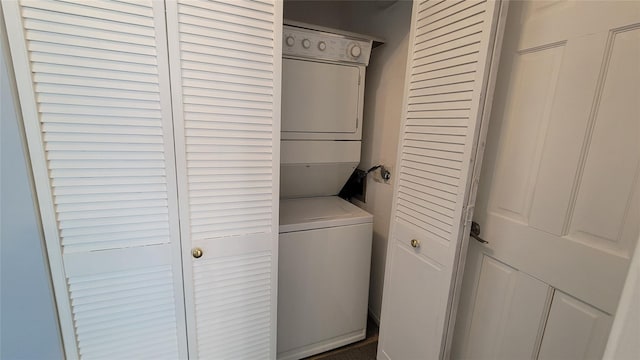 laundry area with stacked washer and dryer and laundry area