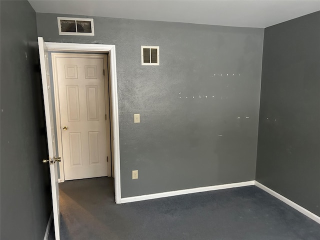 unfurnished bedroom with baseboards, visible vents, and concrete flooring