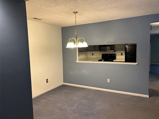 interior space featuring baseboards, a textured ceiling, dark carpet, and a notable chandelier