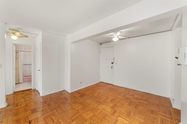 unfurnished room with a ceiling fan