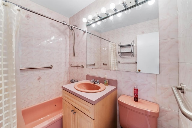 full bathroom featuring decorative backsplash, toilet, shower / bath combination with curtain, vanity, and tile walls