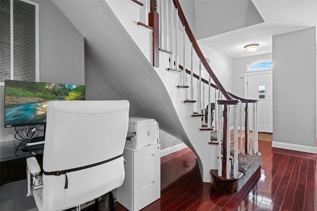 interior space with hardwood / wood-style floors and baseboards