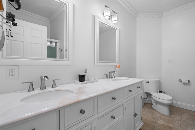 bathroom with toilet, double vanity, ornamental molding, and a sink