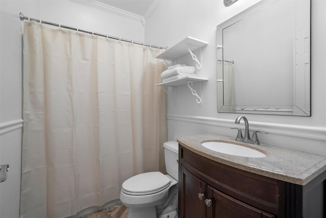 full bathroom with crown molding, vanity, and toilet