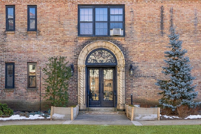 entrance to property with french doors and brick siding