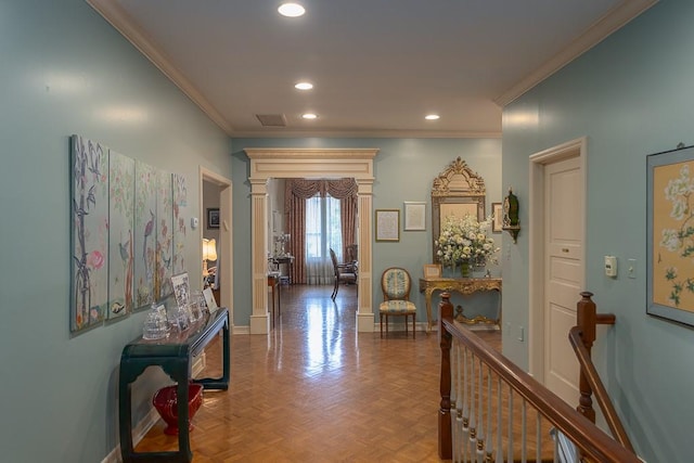 hall featuring baseboards, visible vents, recessed lighting, and crown molding