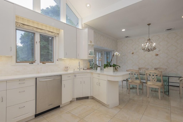 kitchen featuring light countertops, stainless steel dishwasher, white cabinetry, and wallpapered walls