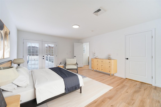 bedroom with visible vents, baseboards, light wood-style flooring, access to outside, and french doors