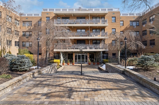 view of building exterior with fence