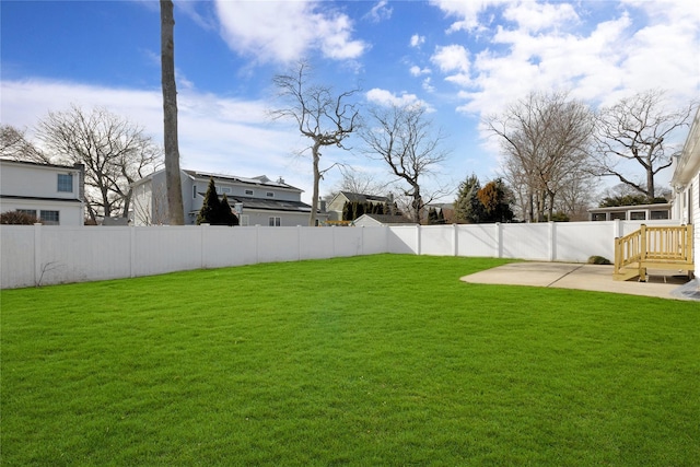 view of yard featuring a patio area and a fenced backyard