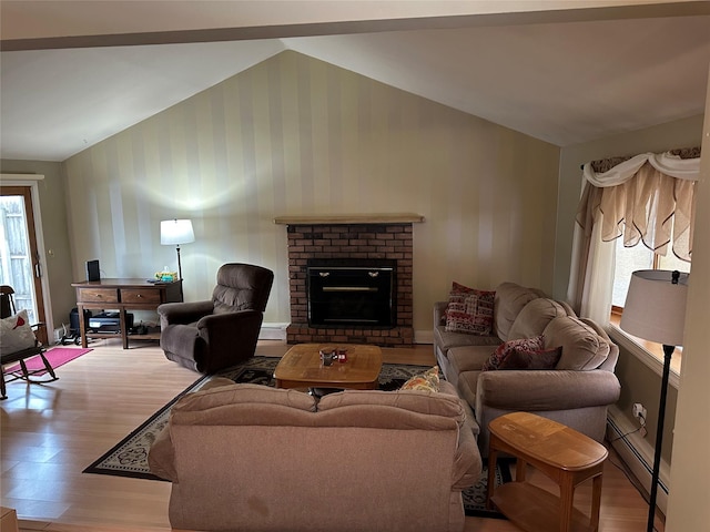 living room featuring a baseboard radiator, a brick fireplace, light wood finished floors, wallpapered walls, and lofted ceiling