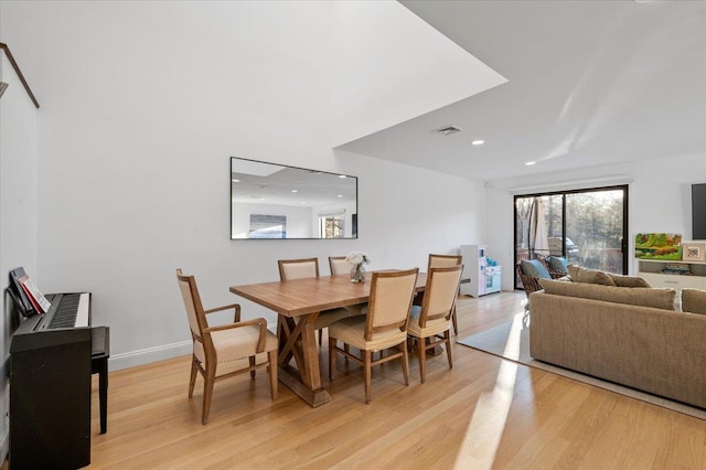 dining room with recessed lighting, light wood-type flooring, visible vents, and baseboards