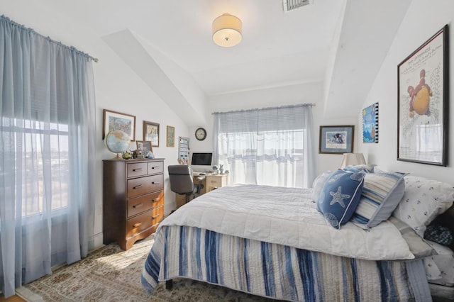 bedroom featuring lofted ceiling