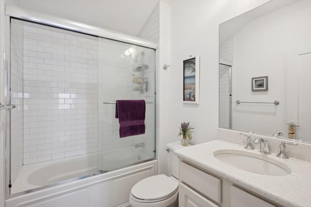 full bath with toilet, bath / shower combo with glass door, and vanity