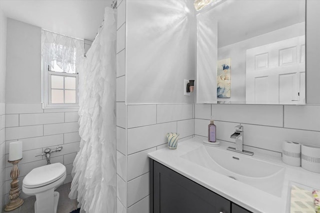 full bath with tile walls, toilet, and vanity