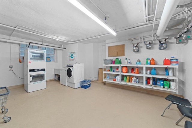 basement with independent washer and dryer and stacked washer / drying machine