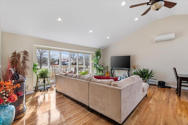 living room with recessed lighting, a baseboard heating unit, light wood-style floors, an AC wall unit, and vaulted ceiling