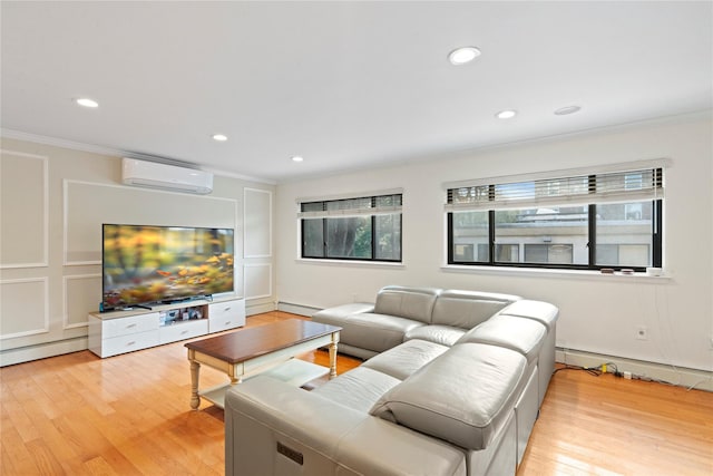 living room featuring ornamental molding, a wall mounted AC, and light wood-style flooring