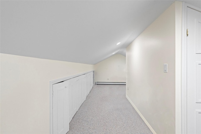 bonus room with light carpet, baseboards, a baseboard heating unit, and vaulted ceiling