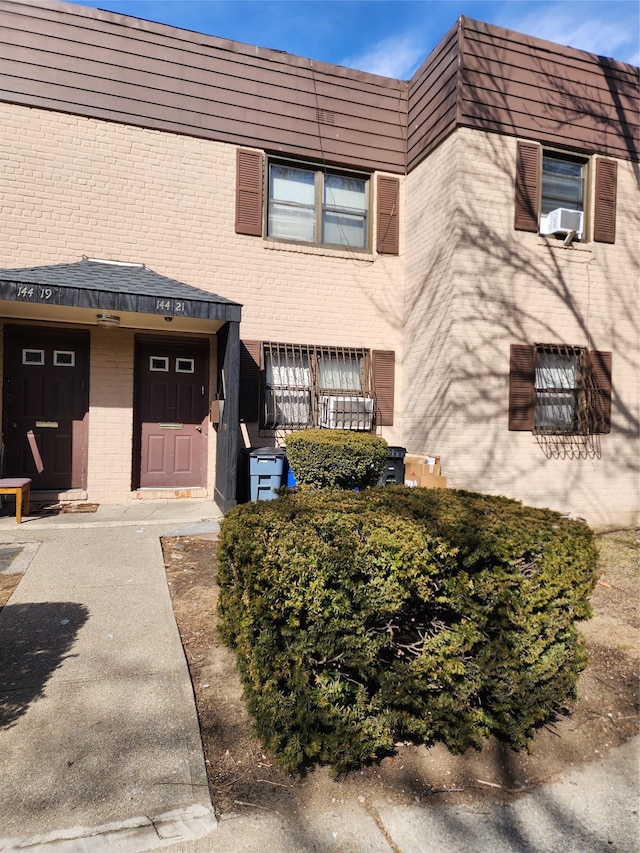 multi unit property with cooling unit and brick siding